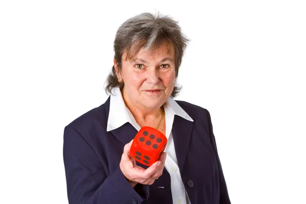 Female senior showing dice — Stock Photo, Image