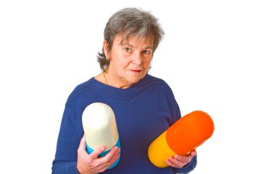 Senior woman with pills clipart