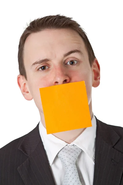 Biznesmen z pusta notatka klej na ustach — Zdjęcie stockowe
