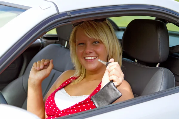 Young woman happy about her new drivers license — Stock Photo, Image