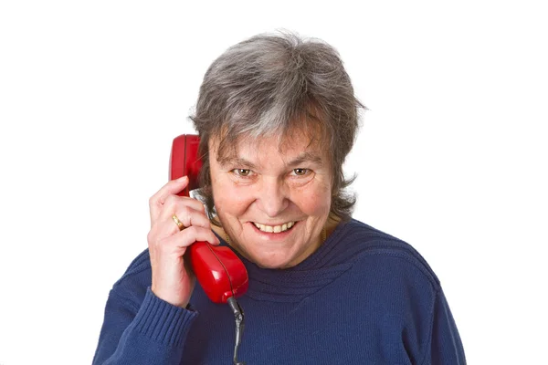 Vrouwelijke senior met telefoonhoorn — Stockfoto