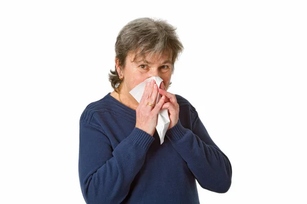 stock image Senior woman blowing her nose