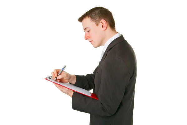 Hombre de negocios escribiendo en un portapapeles —  Fotos de Stock