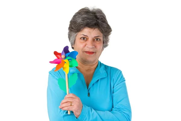 Kobieta starszy gospodarstwa wiatrak — Zdjęcie stockowe