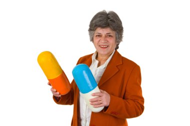 Female senior with two big size pills clipart