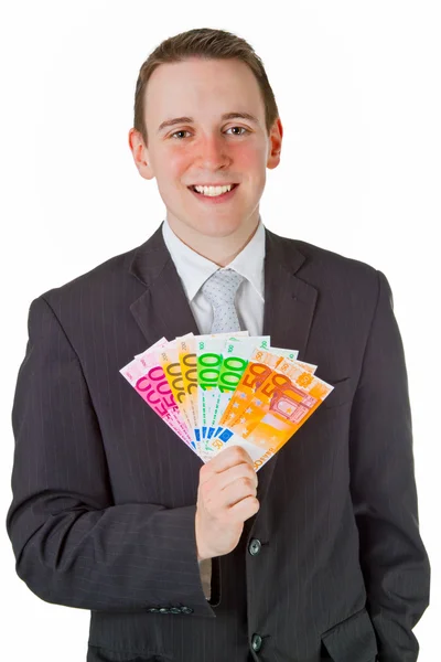 Бизнесмен, держащий евробанкноты — стоковое фото