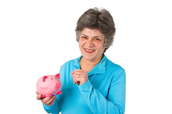 Vrouwelijke senior met piggy bank — Stockfoto