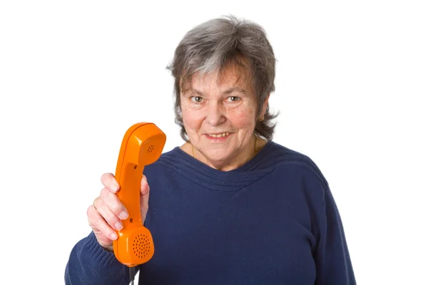 Femme aînée avec récepteur téléphonique — Photo