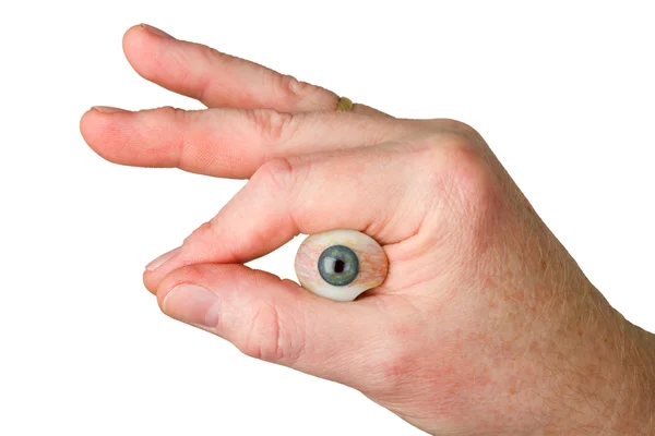 Ruka držící skleněné oko — Stock fotografie