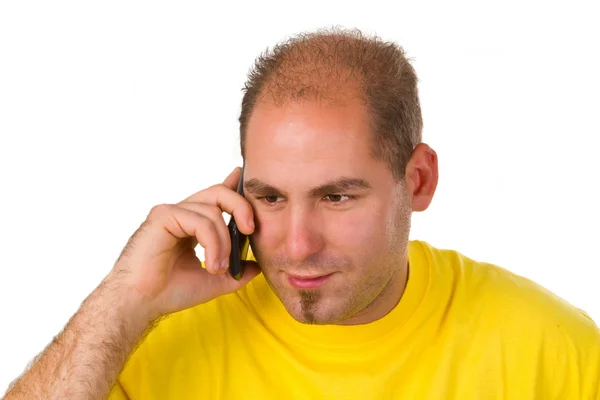 Jonge man praten op een mobiele telefoon — Stockfoto