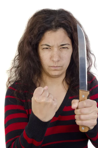 Agressieve jonge vrouw met een gebalde vuist en een keukenmes — Stockfoto