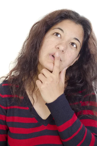 Gondolkodó fiatal nő, és a mutatóujjával, ajkán — Stock Fotó