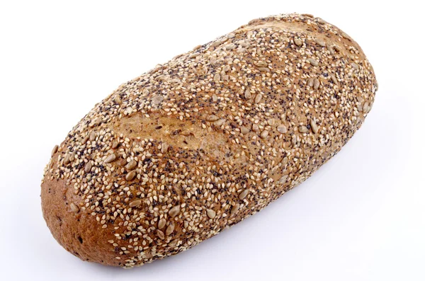 Мультизерновый хлеб и яркий фон — стоковое фото