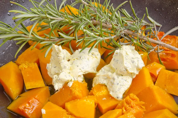 Butternut pumpkin in a pan with butter — Stock Photo, Image