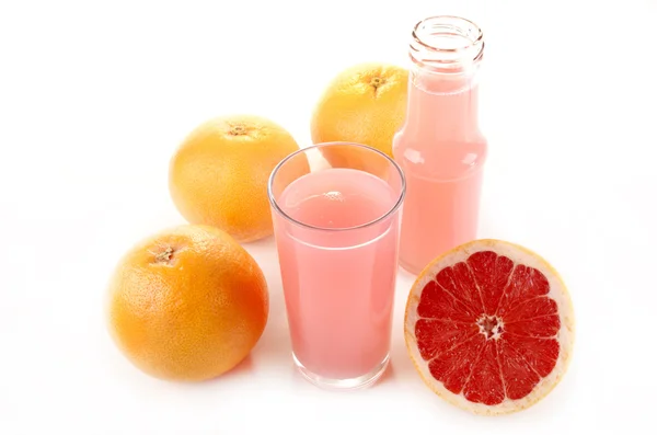 Červený grapefruit a šťávy ve sklenici — Stock fotografie