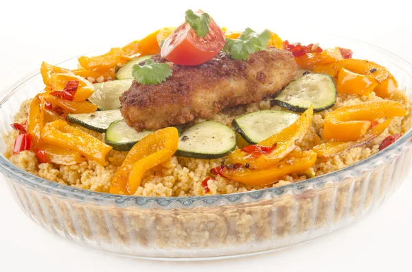 Couscous with courgette and breaded chicken steak — Stock Photo, Image