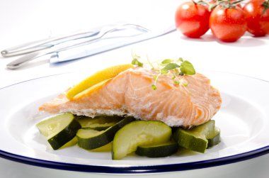 Steamed wild salmon with zucchini clipart