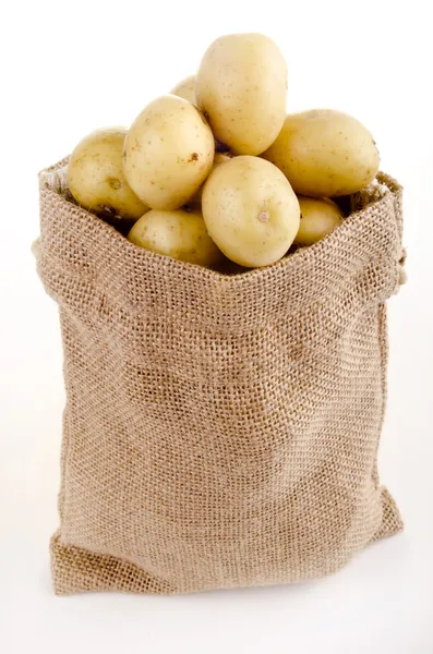 stock image Baby potatoes in a small jute bag