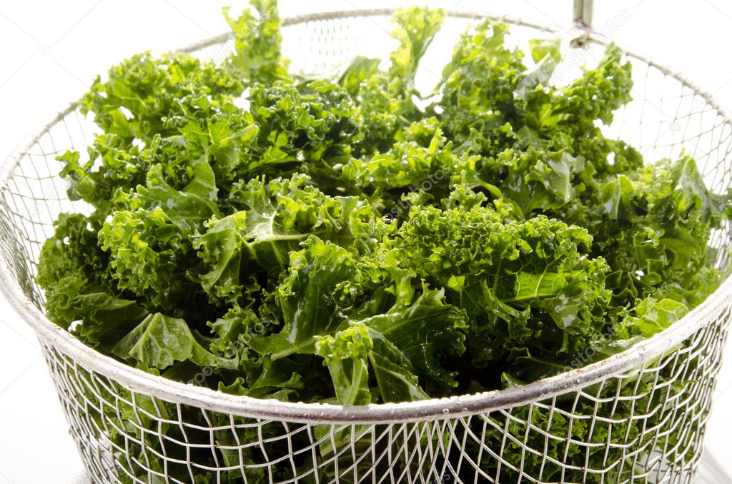 Washed and sliced curly kale in a colander