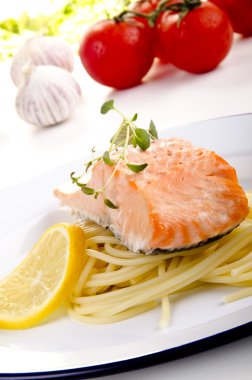 Steamed wild salmon and spaghetti clipart