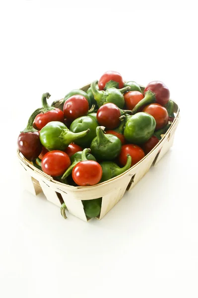 Green and red cherry peppers — Stock Photo, Image