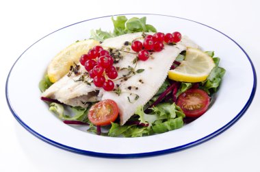 Fresh fried plaice with fresh salad and tomatoes clipart