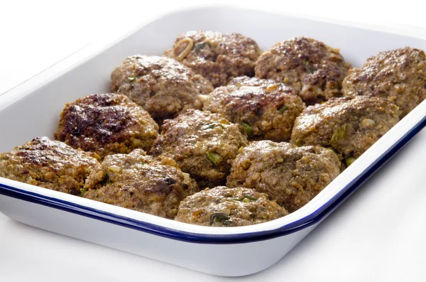 stock image Freshly fried meat balls in a blue and white enamel bowl