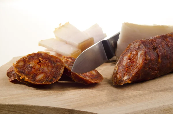 Salami cut into small slices — Stock Photo, Image