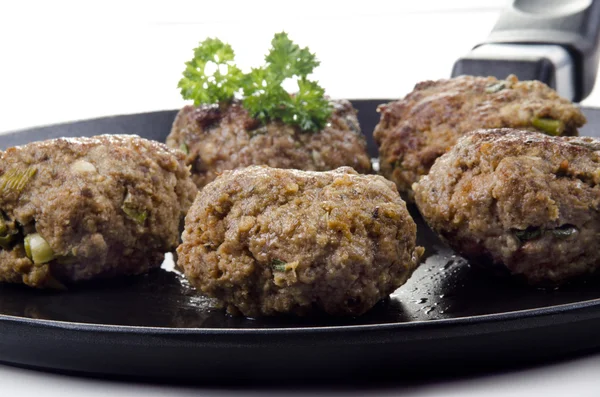Freshly fried meat balls lying on a pan — Stock Photo, Image