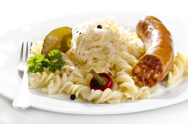 Sauerkraut with noodle and home made sausage — Stock Photo, Image