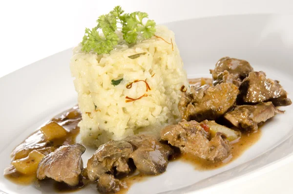 Chicken liver and rice with saffron — Stock Photo, Image