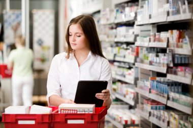 Female Pharmacist with Digital Tablet