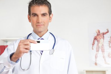 Doctor Holding a Medicine Packet clipart