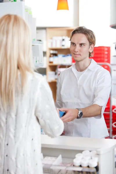 Male Pharmacist With A Customer In Pharmacy — Stock Photo, Image