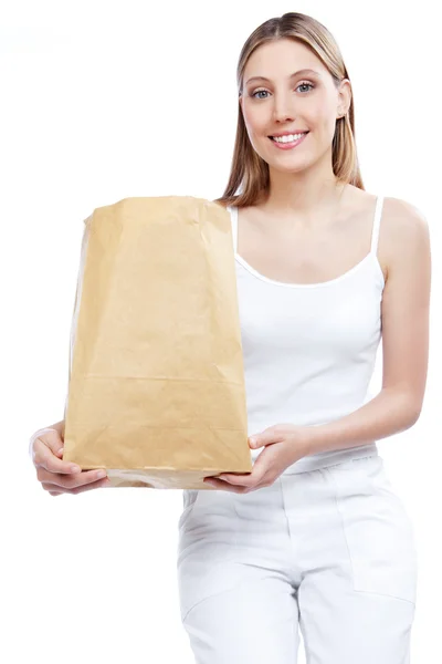 Mulher segurando saco de papel de compras — Fotografia de Stock