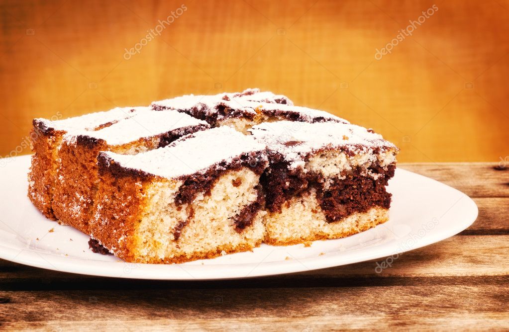Chocolate and vanilla sponge cake served on a plate