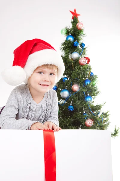 stock image Little girl near the Christmas Tree