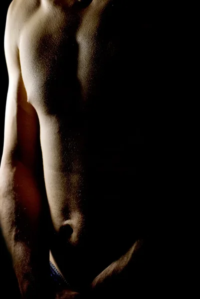 Låg nyckel bild av manliga kroppen — Stockfoto