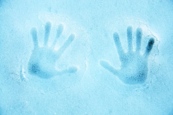 Snow texture with hand print — Stock Photo, Image