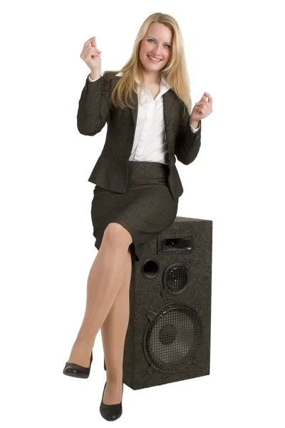 Happy Businesswoman Sitting On Speakers — Stock Photo, Image