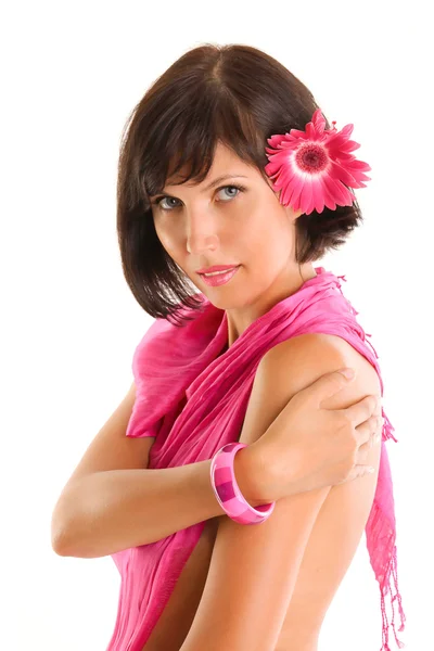 Beautiful brunette woman with pink flower — Stock Photo, Image