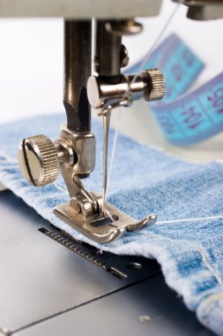 Close-up of sewing maching with cotton clipart