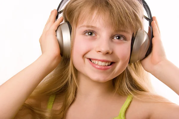 Kulaklıklar ile güzel bir mutlu kız — Stok fotoğraf