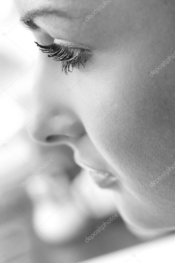 Beautiful young woman face profile close-up