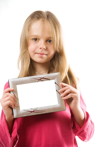 Linda niña sosteniendo marco de fotos — Foto de Stock