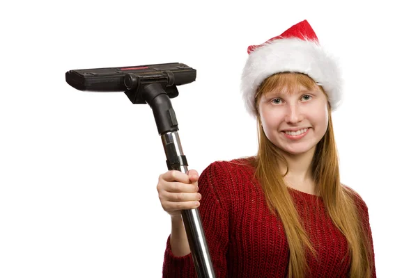 Usmívající se dospívající dívka v santa hat s vysavačem koště — Stock fotografie
