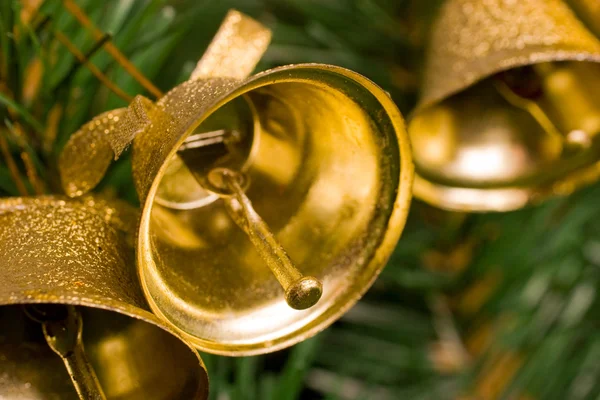 Golden bells on christmas tree — Stock Photo, Image