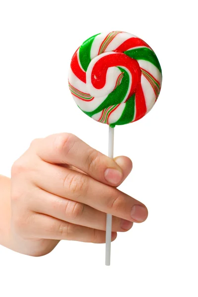 Hand holding colourful lollipop — Stock Photo, Image