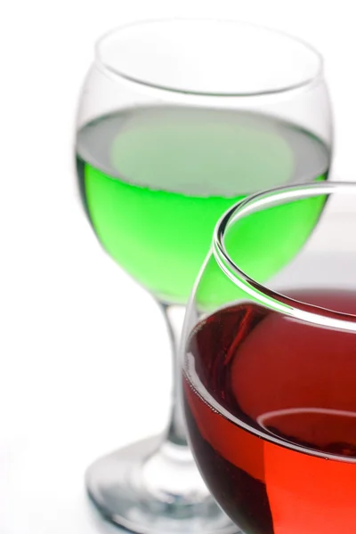 Glazen met multi gekleurde vloeistoffen — Stockfoto
