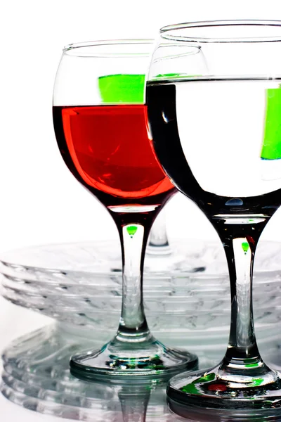 Artículos de vidrio con líquidos multicolores Imagen de archivo